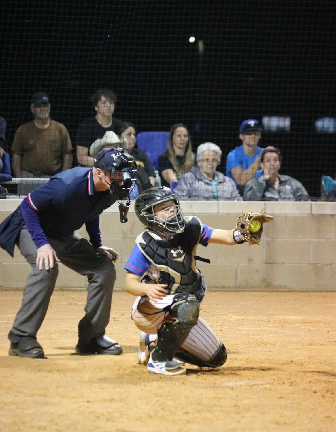 Larkin Spears catching for the Quitman Lady Bulldogs.